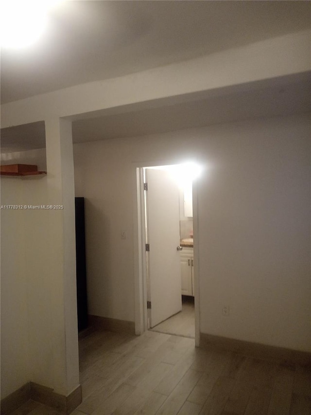 hallway featuring light wood-style flooring