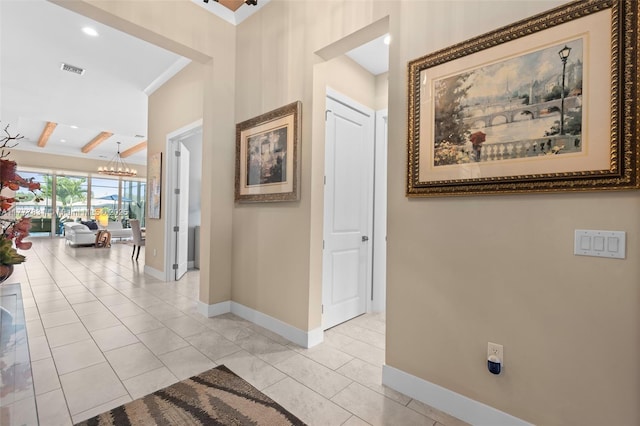 hallway featuring visible vents, baseboards, light tile patterned floors, a chandelier, and recessed lighting