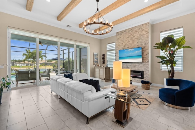 living room featuring beamed ceiling, a fireplace, an inviting chandelier, a sunroom, and tile patterned floors