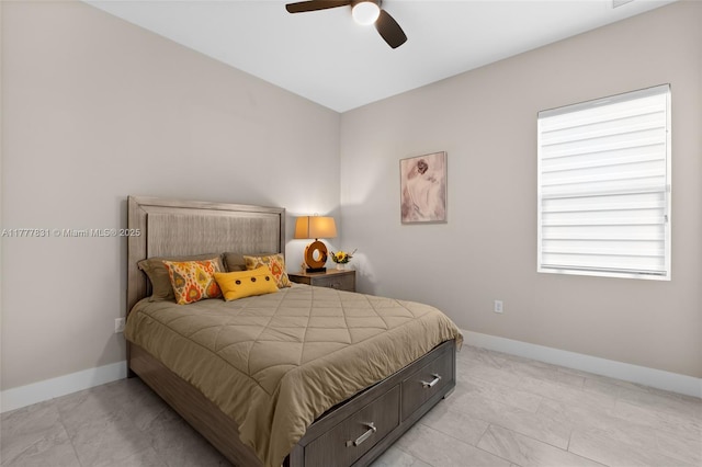 bedroom featuring baseboards and ceiling fan