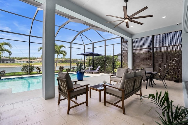 view of patio / terrace featuring an outdoor pool, glass enclosure, an outdoor hangout area, and ceiling fan