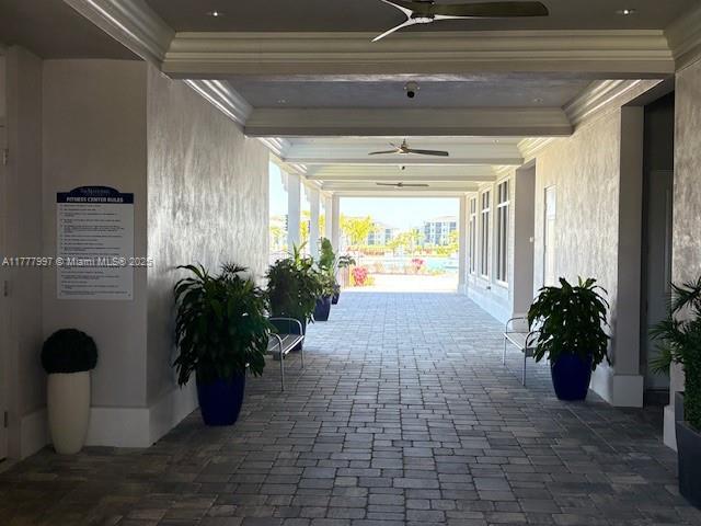 exterior space featuring ceiling fan