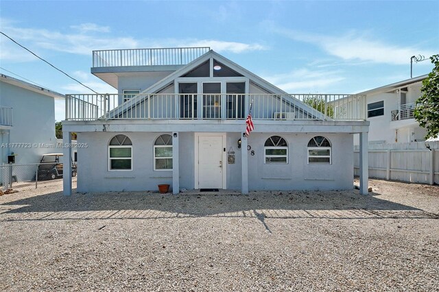 108 Long Ben Dr, Key Largo, FL 33037 - view of front of house with stucco siding and fence
