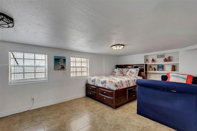 108 Long Ben Dr, Key Largo, FL 33037 - bedroom featuring a textured ceiling and baseboards