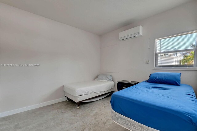 108 Long Ben Dr, Key Largo, FL 33037 - bedroom with a wall mounted AC and baseboards