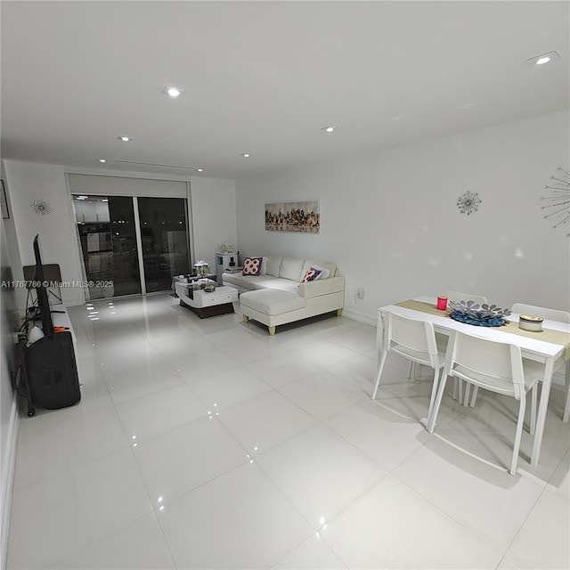 2750 NE 183rd St Unit 301, Aventura, FL 33160 - living room with light tile patterned floors, baseboards, and recessed lighting