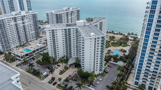 birds eye view of property with a view of city and a water view