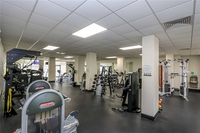 workout area with visible vents and a drop ceiling