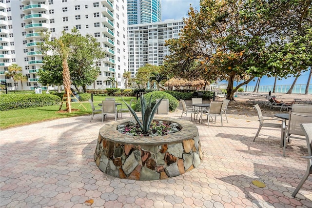 view of property's community with a view of city and a patio area