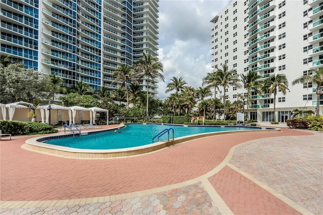 community pool with a patio area