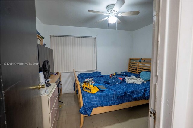 bedroom featuring tile patterned floors and ceiling fan
