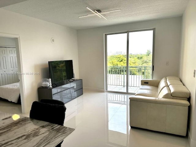 living room with a textured ceiling