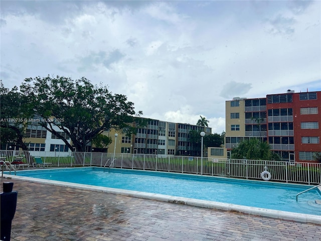 community pool featuring fence