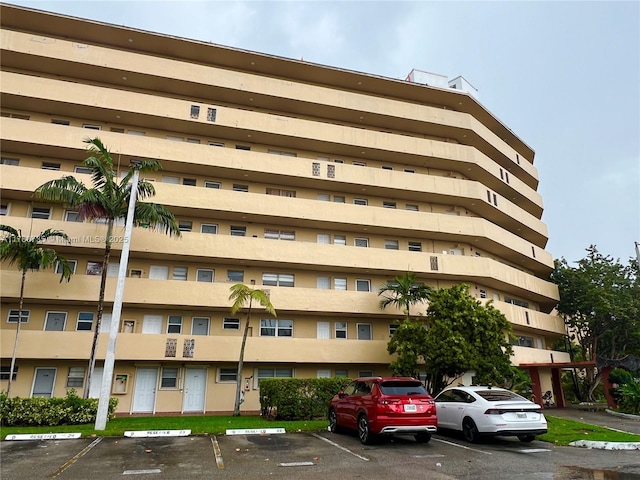 view of property featuring uncovered parking