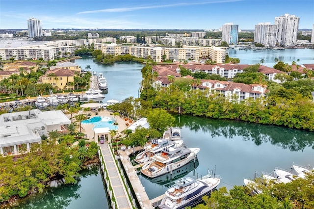 drone / aerial view featuring a view of city and a water view