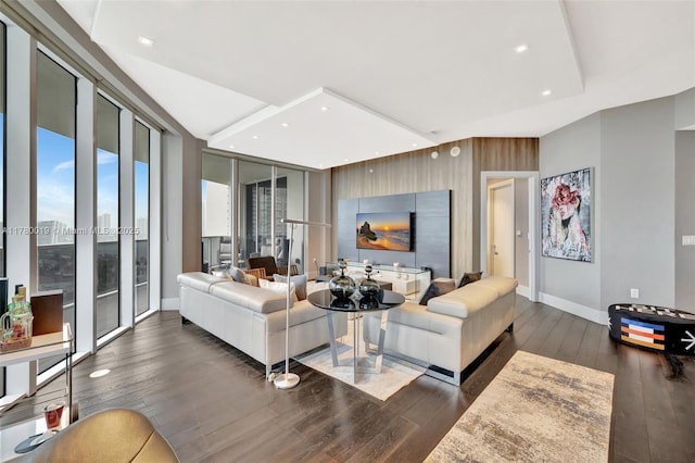 living room with recessed lighting, baseboards, and hardwood / wood-style flooring