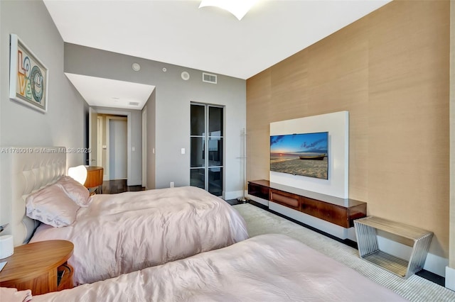 bedroom featuring visible vents, baseboards, and carpet floors