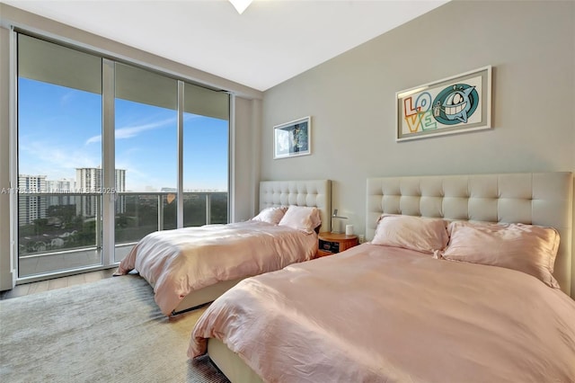 bedroom featuring a city view and access to outside