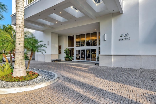 property entrance with stucco siding