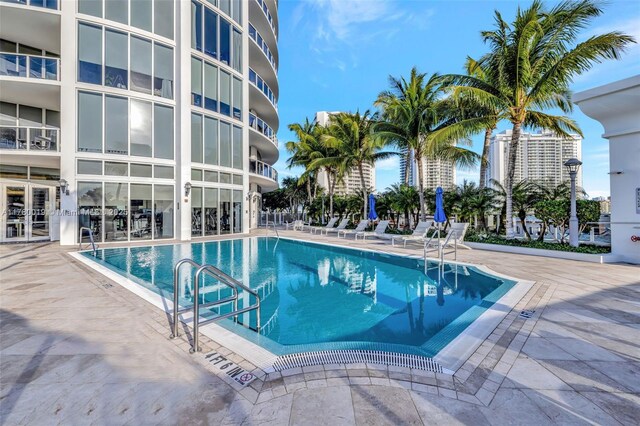 community pool featuring a patio area