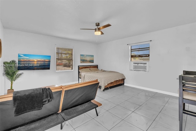 bedroom with baseboards, cooling unit, and a ceiling fan