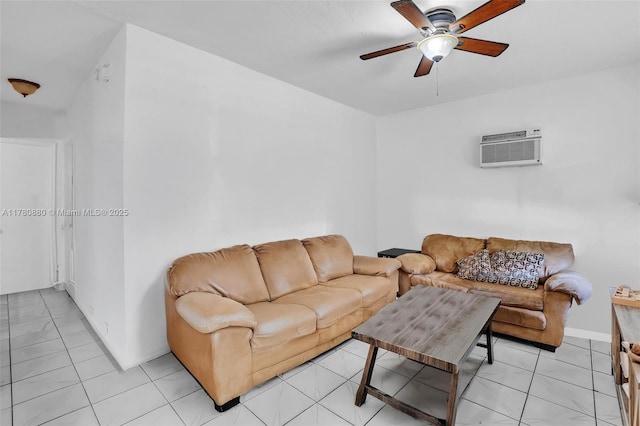 living room featuring a wall unit AC, ceiling fan, baseboards, and light tile patterned floors
