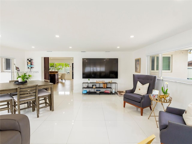 living area featuring light tile patterned flooring and recessed lighting