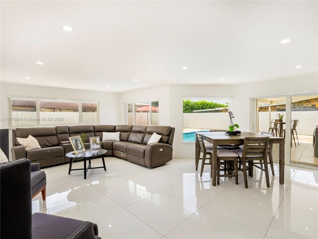 living room featuring recessed lighting and light tile patterned floors