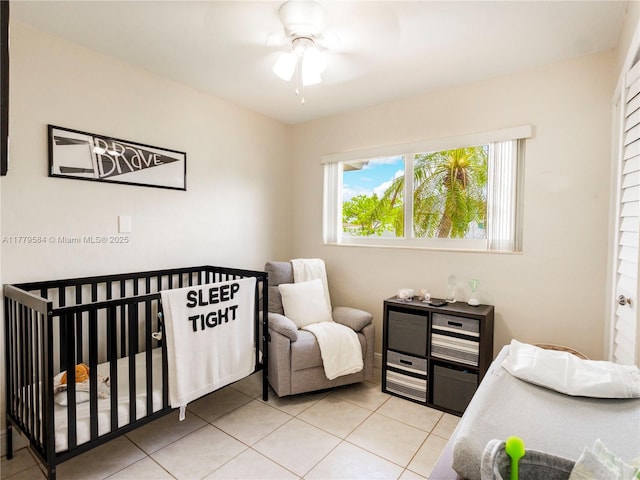 bedroom featuring light tile patterned floors and a ceiling fan