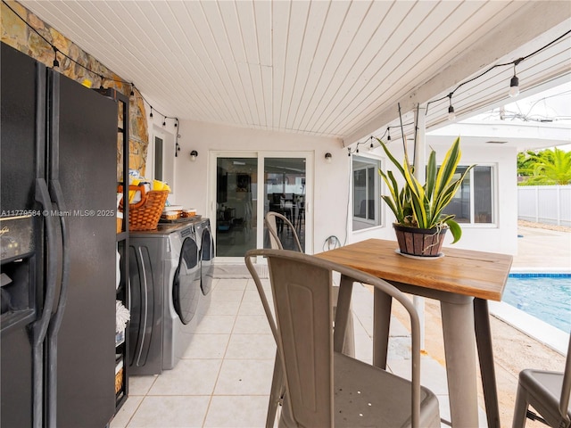 exterior space with washer and dryer, a fenced in pool, and outdoor dining area