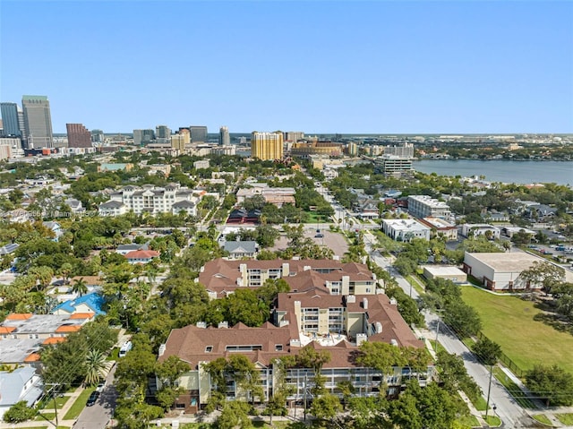birds eye view of property with a view of city and a water view