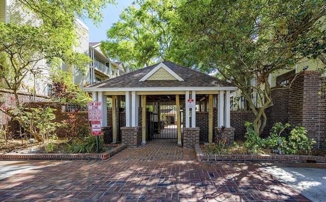 exterior space featuring a gate