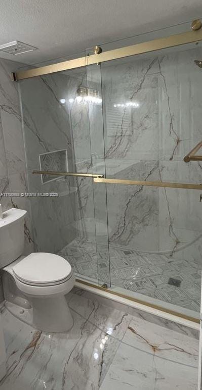 full bath featuring toilet, a marble finish shower, and visible vents
