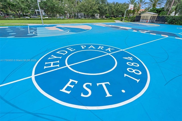 view of sport court featuring community basketball court, a yard, and fence