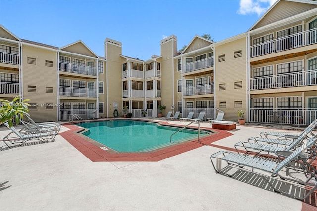 community pool featuring a patio