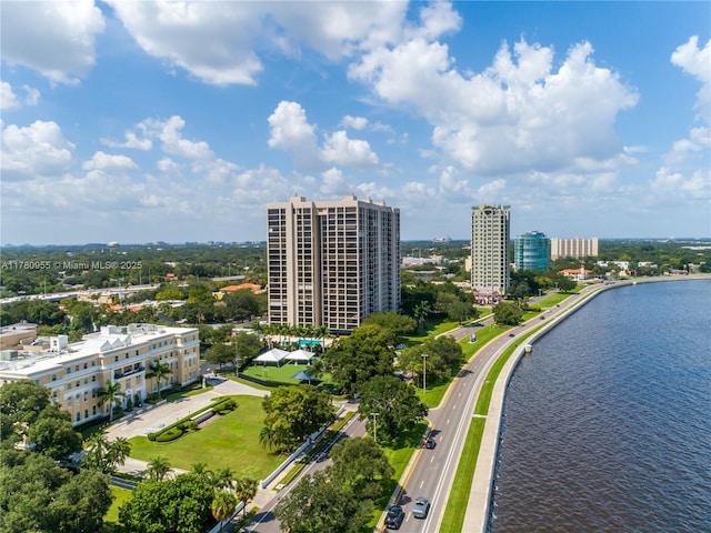 birds eye view of property featuring a city view and a water view