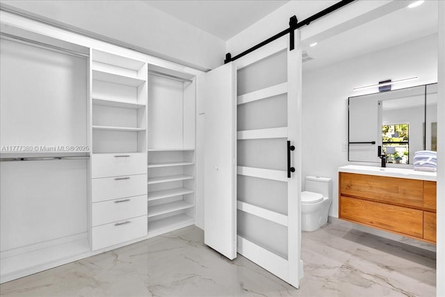 2021 SW 23rd St, Miami, FL 33145 - walk in closet with light marble finish flooring and a barn door