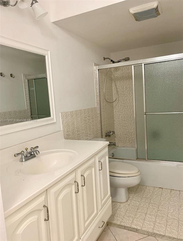1825 S Ocean Dr Unit 503, Hallandale Beach, FL 33009 - bathroom featuring vanity, bath / shower combo with glass door, and tile patterned flooring