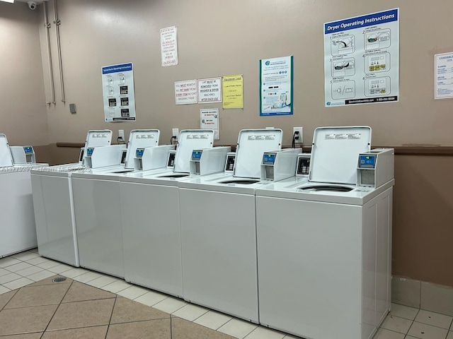 1825 S Ocean Dr Unit 503, Hallandale Beach, FL 33009 - community laundry featuring separate washer and dryer and light tile patterned flooring