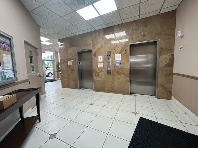 1825 S Ocean Dr Unit 503, Hallandale Beach, FL 33009 - lobby with tile walls and a paneled ceiling