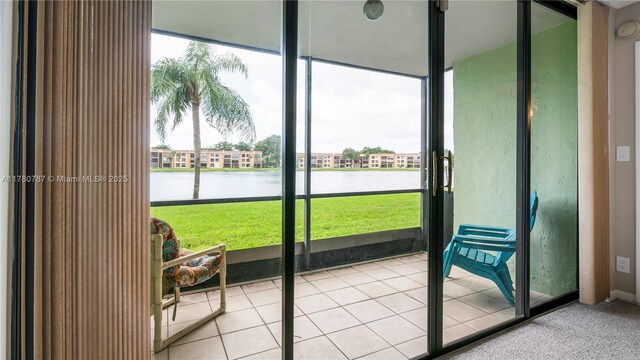 6106 Coral Lake Dr Unit 106, Margate, FL 33063 - unfurnished sunroom featuring a water view and plenty of natural light