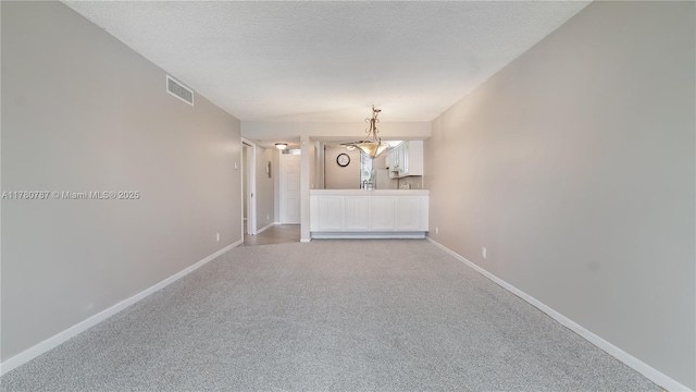 6106 Coral Lake Dr Unit 106, Margate, FL 33063 - empty room featuring visible vents, baseboards, light colored carpet, and a textured ceiling
