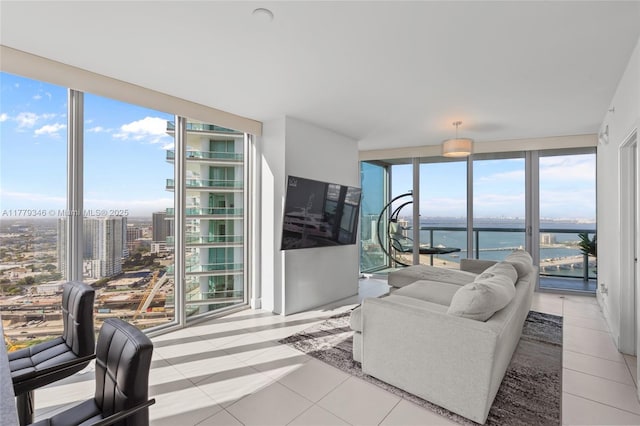 living room featuring light tile patterned floors and floor to ceiling windows