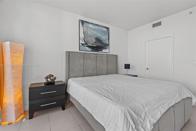 bedroom with visible vents and light tile patterned floors