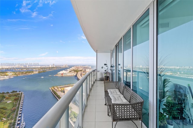 balcony with visible vents and a water view