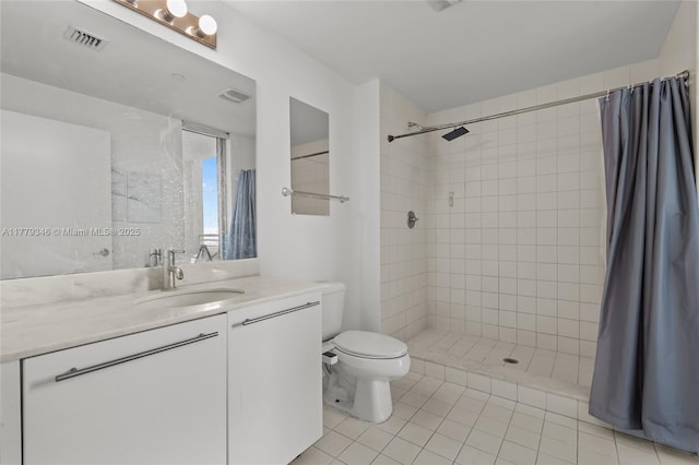 bathroom with tile patterned floors, visible vents, toilet, vanity, and tiled shower