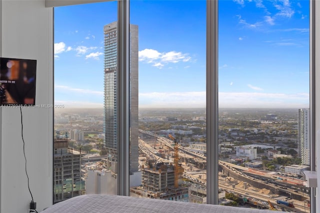 bedroom with a view of city