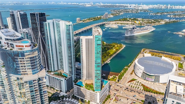 birds eye view of property featuring a city view and a water view