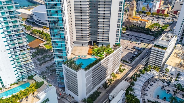aerial view featuring a city view and a water view