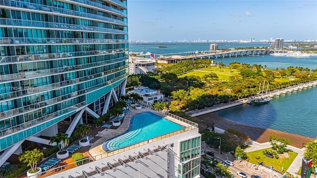 birds eye view of property with a water view
